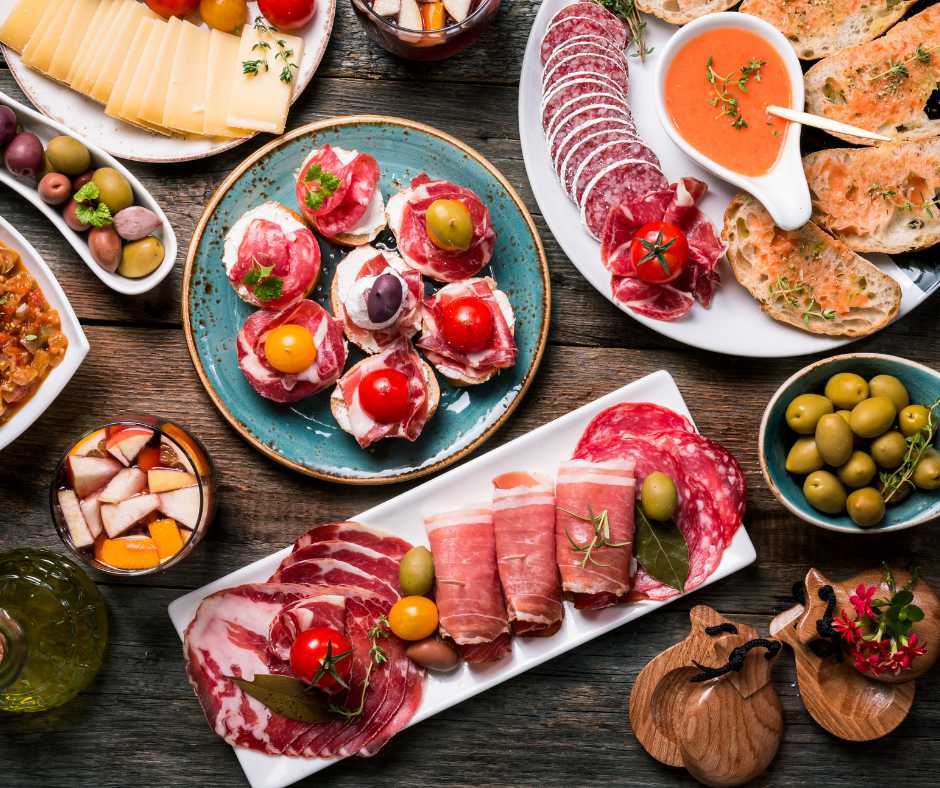 table with iberico and cheese with olives