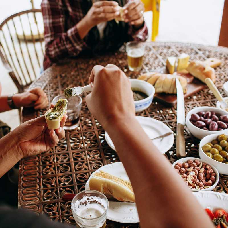 trying food from an aperitif table